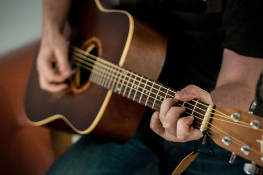 Man Playing Acoustic Guitar